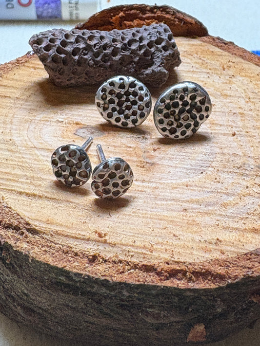 Sterling silver studs.