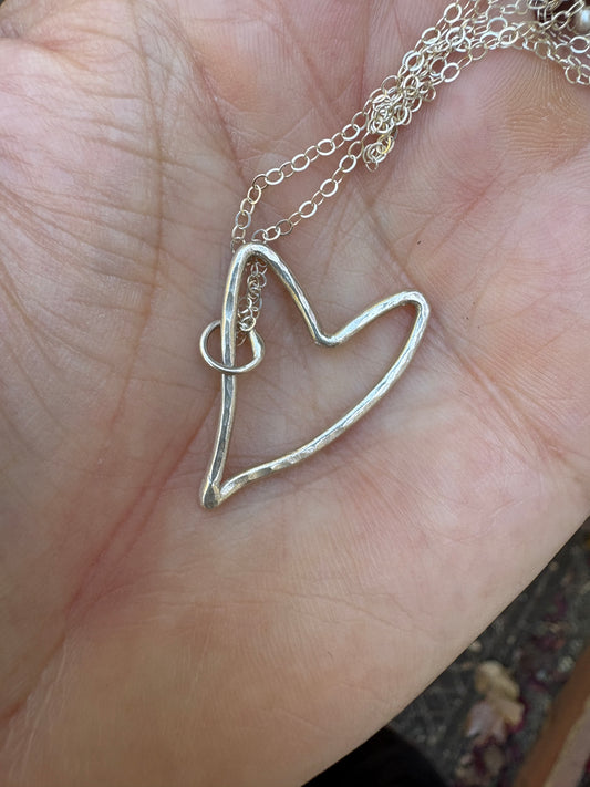 Floating heart charm necklace